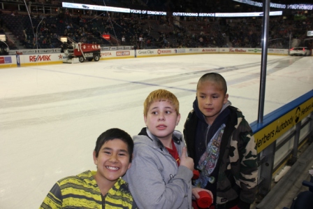 Phillip Hope, Connor Desjarlais and Logan Corrigal enjoy the game.