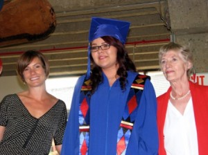 Valedictorian Julia Gladue received a $1,500 award from Royal Glenora Rotary Club representatives Kristine Price and Catarina Versaevel