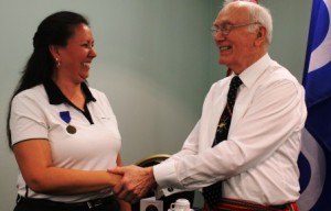 Veteran Brenda Woods cracks a smile after being formally inducted as a new AVSA member. 