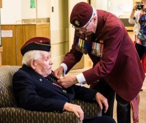 Second World War veteran Edmond Gagne, 93, is presented the French Legion of Honour medal by WWII veteran John MacDonald during a ceremony at the Kipnes Centre for Veterans on Wednesday, Sept. 17, 2014.  Photo: Metis Nation of Alberta 