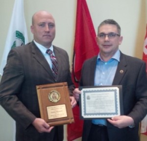 Sgt. James Bennett (l) is being presented the Officer of the Year Award by Chief Lee Boyd of BTPS at the AGM in Gatineau PQ .