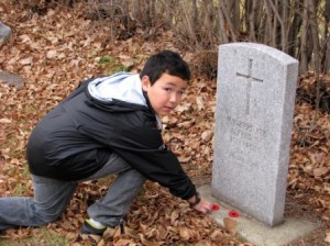 Ryan is one of more than 20 Grade 5 students at St. Albert's Betha Kennedy School to place a poppy on a soldier's gravesite during a No Stone Left Alone ceremony. 