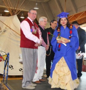 Elders Don Langford, Leith Campbell and Francis Whiskeyjack present Jaycee Ahenakew with Amiskwaciy Society's $1500 Cultural Award.