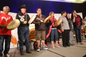 A mix of tradtional drummers singers perform on stage at the Delta Hotel during the Closing Ceremonies of the TRC