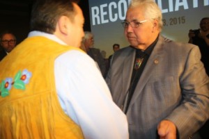 Commissioner Murray Sinclair gives AFN Chief Perry Bellegarde a copy of the Final TRC Report