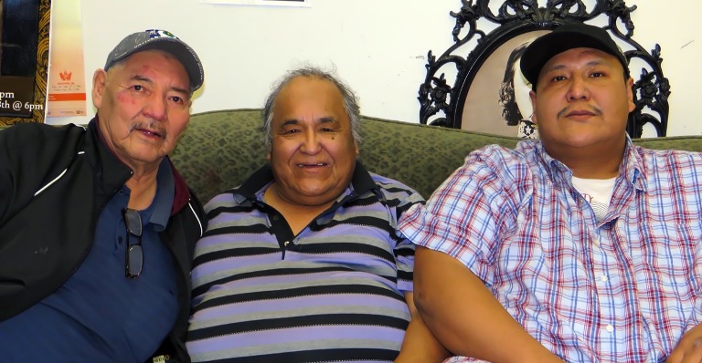 Elder Joe Pahpayken (c) conducted a Pipe Ceremony at Blessed Oscar Romero School with the aid of his son, Clint (r) and Elder Morris Nicotine.