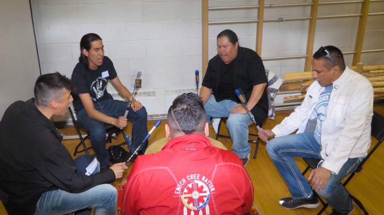 Adrian LaChance (far right) spoke to the students and participated in Drum songs and chants.