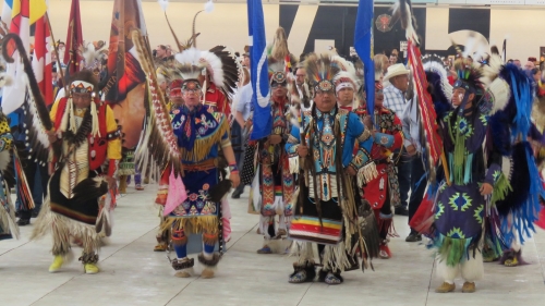 Flag and staff carriers led the Grand Entry at Ben Calf Robe 2016 Pow Wow.. Article and photos by John Copley 