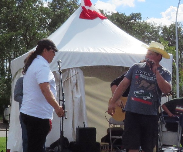 Aboriginal Pavilion emcee Ron Walker introduces fiddling sensation Daniel Gervais to the Heritage Day Festival crowd. Gervais was one of nine outstanding performers who participated in the Aboriginal Pavilion during the Aug long weekend festival which took place at Hawreluk Park in Edmonton. 