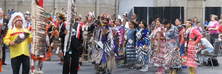 Powwow dancers participate in Grand Entry during final day of 10-day K-Days PowWow.