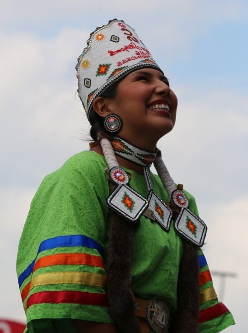 Indian Village Princess Vanessa Stiffarm addresses the huge crowd at the Calgary Stampede rodeo.  Photo by Terry Lusty