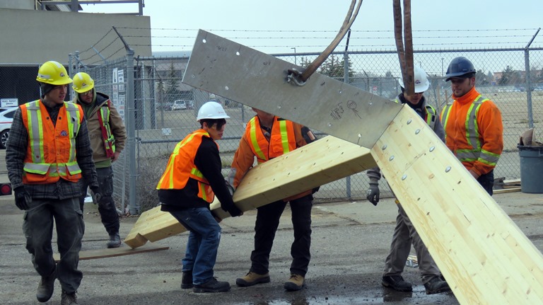 Ledcor employees and Amiskwaciy students helped to put the heavy galvanized roof structure together.