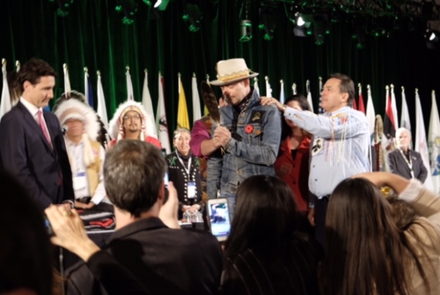 CBC photo of AFN National Chief Perry Bellegarde honouring Gord Downie. 