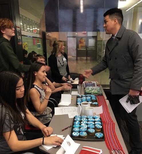 Naim Cardinal speaks to the students at the Strathcona High School Metis Week Celebration. 