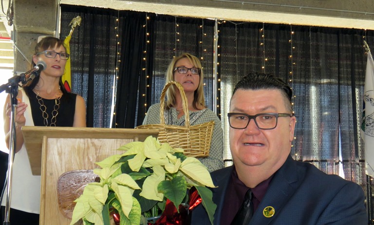 Amiskwaciy Academy Principal Fred Hines and staff members drew tickets and presented an array of Christmas poinsettas. 